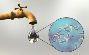 dripping water from a faucet with bacteria concept