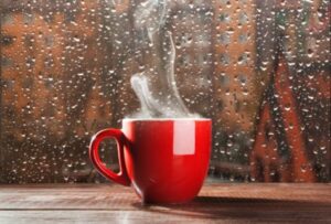 steaming hot coffee on a rainy day