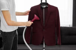 a man holding a coat