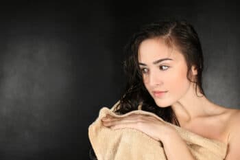 a woman holding a towel