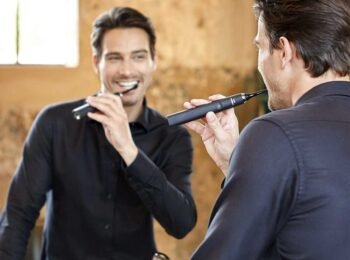 hadsome man brushing teeth