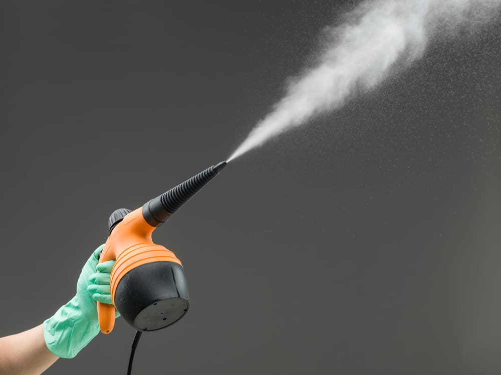 how to use a handheld steam cleaner