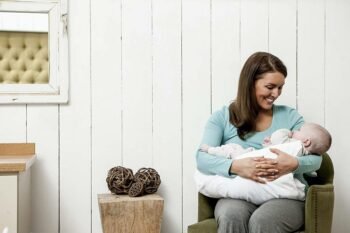 mother carrying baby