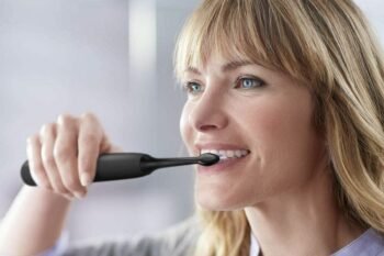 woman brushing teeth