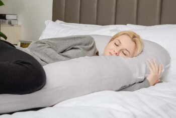 woman hugging total body cushion
