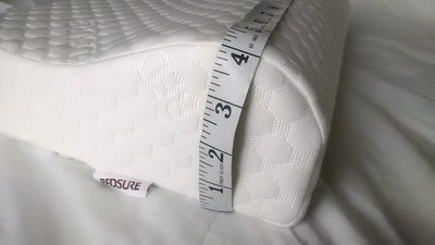a-measuring-tape-around-a-white headrest