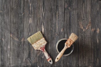 two old brushes on an old table